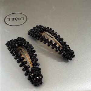 Two large black beaded hair clips. Never worn.